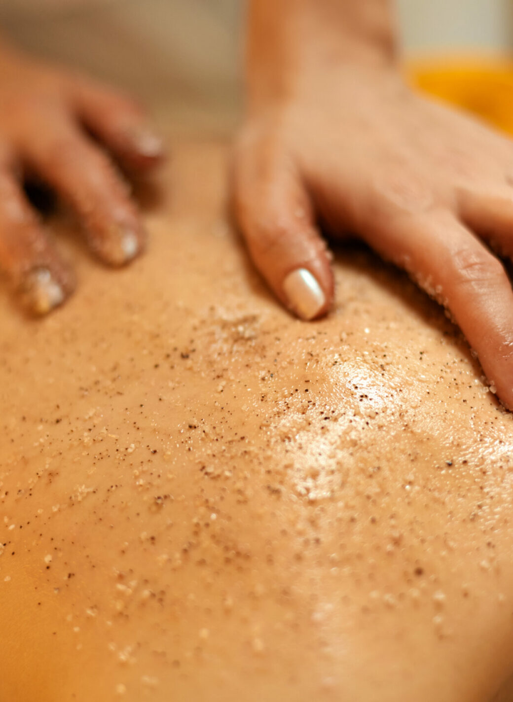 Body Scrub. Beautiful Blonde Gets a Salt Scrub Beauty Treatment in the spa Salon