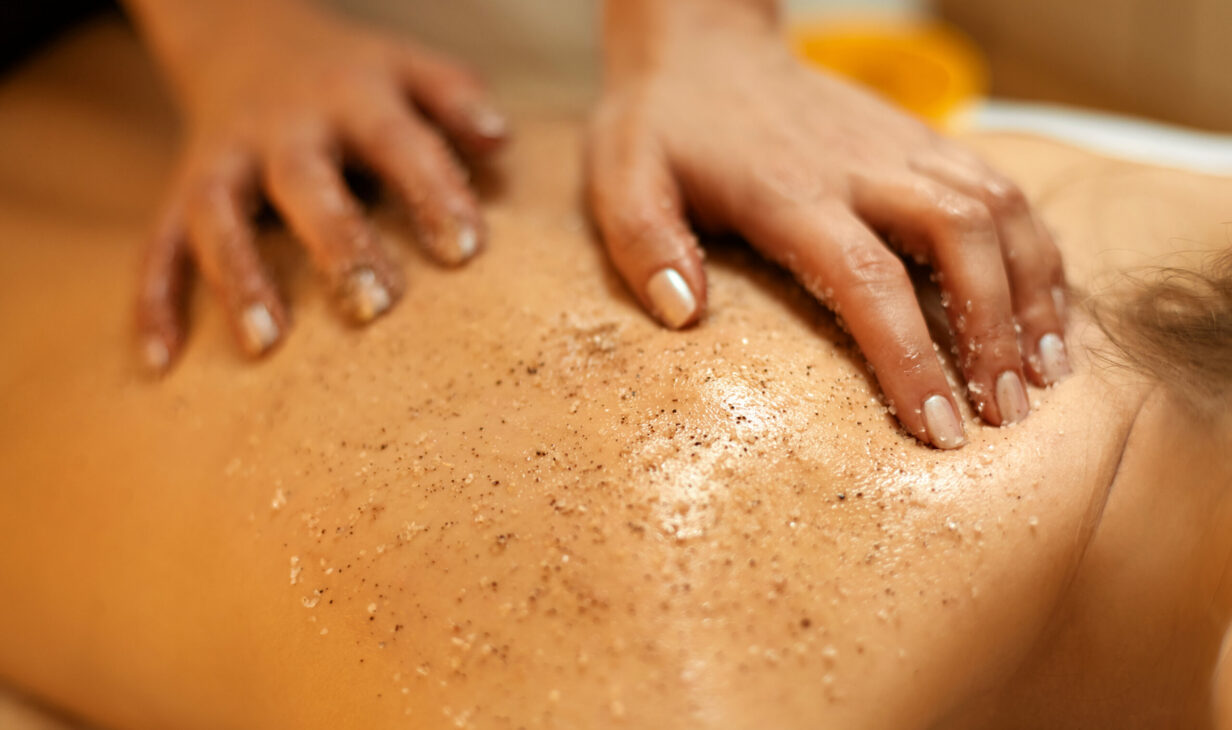 Body Scrub. Beautiful Blonde Gets a Salt Scrub Beauty Treatment in the spa Salon
